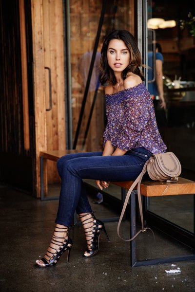 Dark blue blouse with off-the-shoulder lace and dark blue jeans