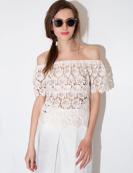 semi-sheer lace top with wide-leg white linen pants