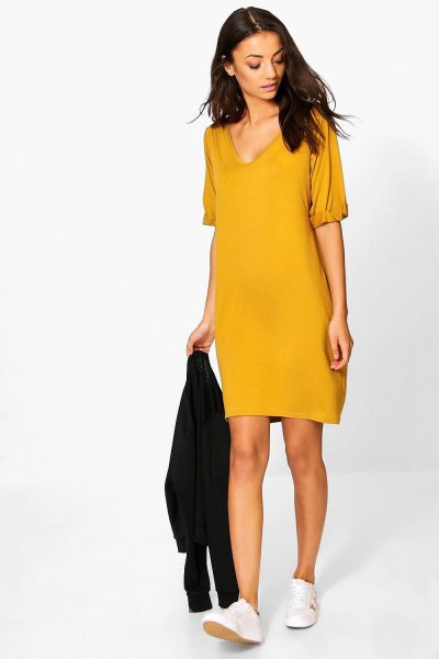 Mustard yellow V-neck t-shirt dress and white sneakers