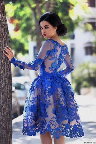 Knee length semi-sheer lace dress in royal blue with a flared fit