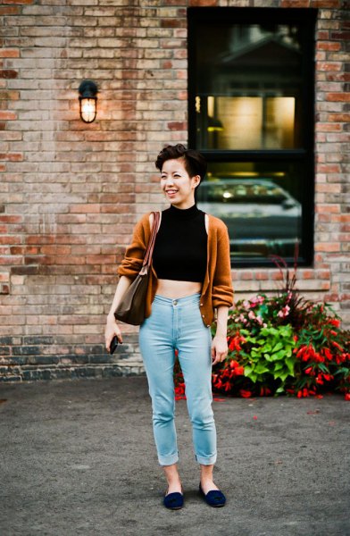 black mock neck crop top with light green cardigan and mom jeans