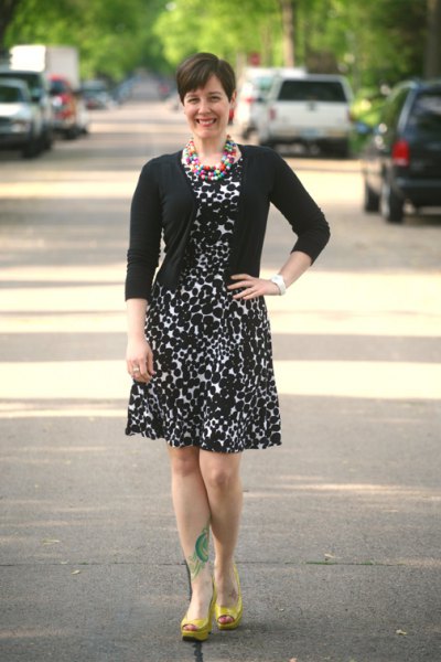 black cardigan with knee length leopard print flared dress