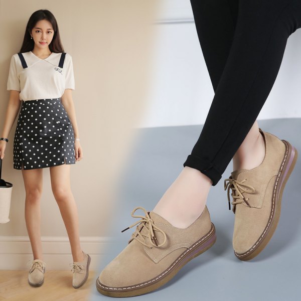 white blouse with black polka dot mini skirt and light camel suede shoes