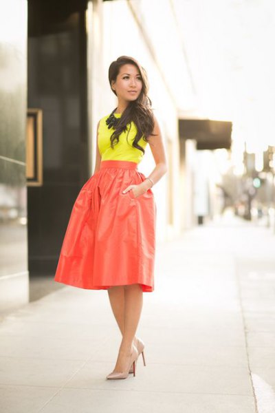 yellow top high waisted red skirt