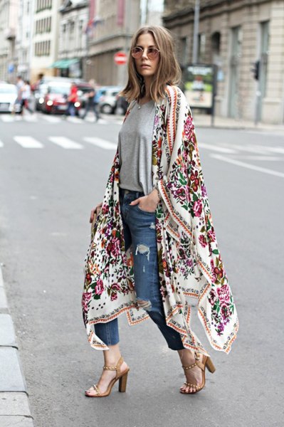 white floral print maxi cardigan and blue slim-fit jeans