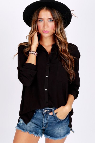 Button-down shirt with blue jean shorts and black felt hat
