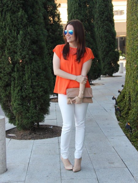 orange short-sleeved blouse with white slim fit jeans