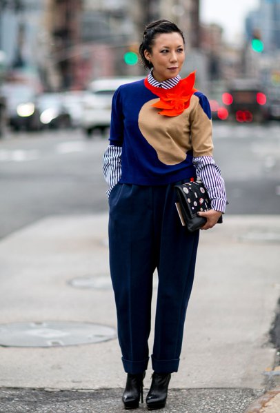 royal blue sweater with striped round collar shirt and black pants
