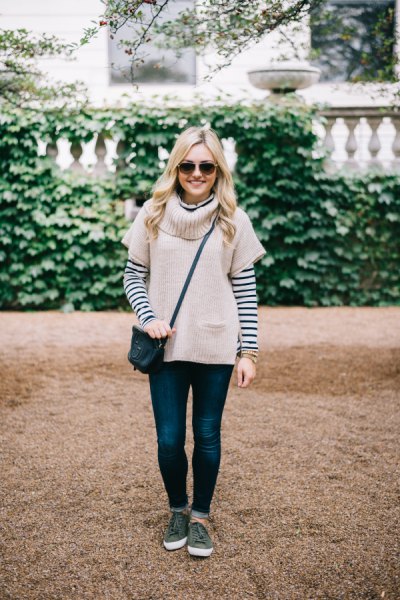 Light pink short sleeve sweater with a black and white striped t-shirt