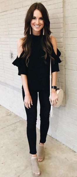 black cold shoulder blouse with skinny jeans and open toe boots
