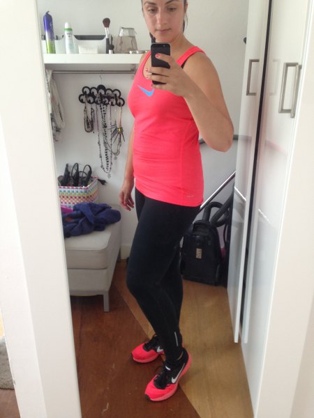 pink tank top with black running leggings and sneakers