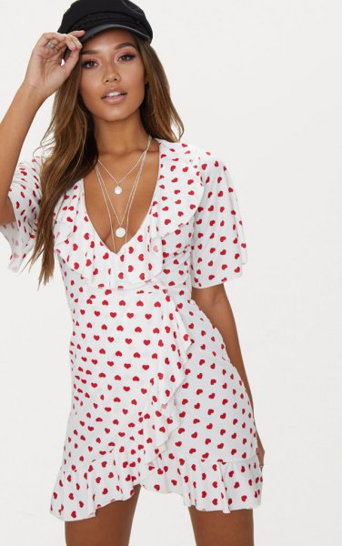 White and red heart print mini ruffle wrap dress with V-neckline