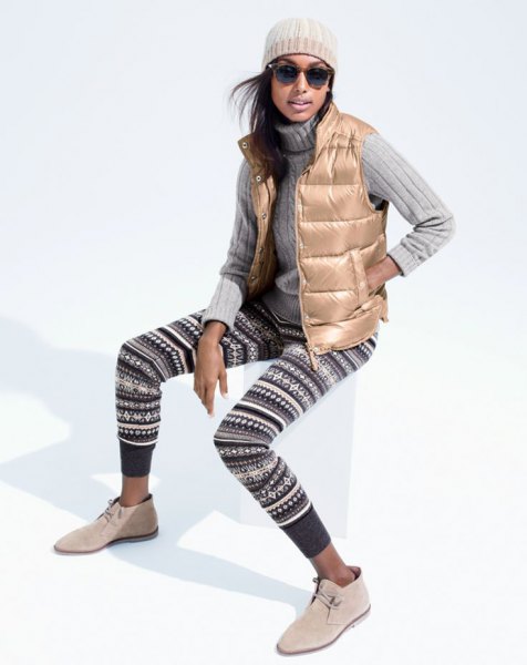 golden down vest with black and white tribal sweater leggings