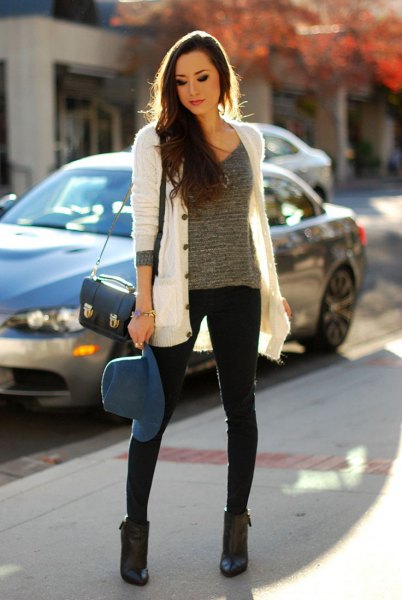 white cardigan with gray scoop neck knit sweater and black skinny jeans