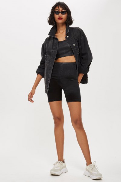 black denim jacket with a cropped top and matching cycling shorts