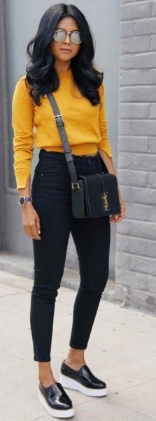 Mustard knit sweater with black slim fit jeans