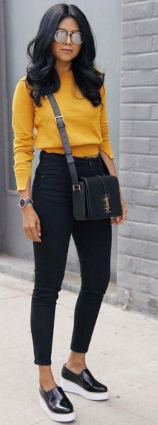 Mustard yellow slightly cropped sweater with black ankle jeans