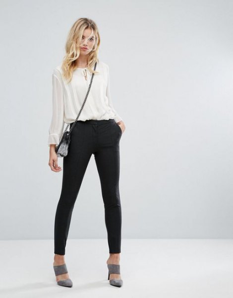 white semi-transparent chiffon blouse with black joggers and gray heels