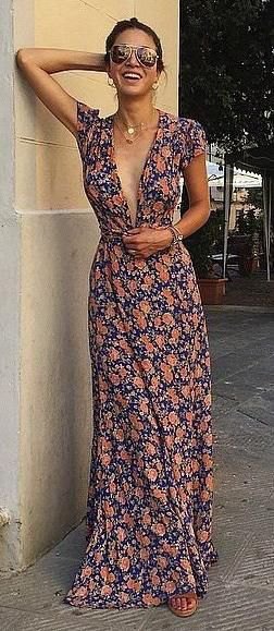 Floor-length dark blue and pink dress with a deep V-neckline and floral pattern