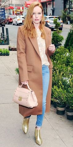Blush pink maxi wool coat worn with a floral print blouse and light blue skinny jeans