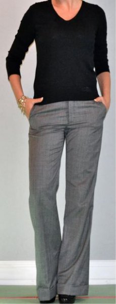 Black V-neck sweater and gray wide-leg suit trousers