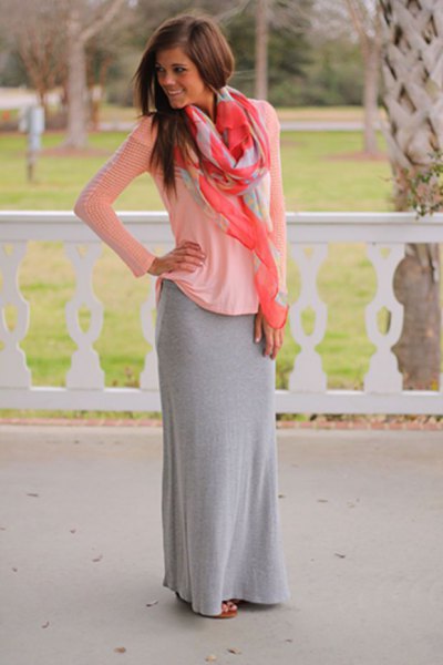 White long-sleeved scoop neck top and floor-length gray cotton skirt