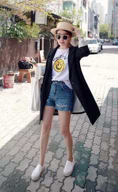 black longline cardigan with white printed t-shirt and blue denim shorts
