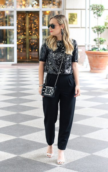 black sparkly top with matching chinos and white sandals