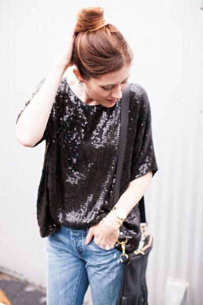 black oversized sequin t-shirt with blue slim fit jeans