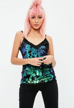 black V-neck sequin camisole and skinny jeans