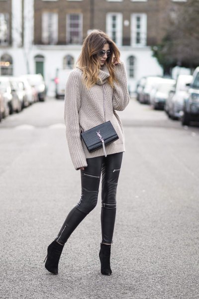 gray ribbed cowl neck sweater and black leather pants