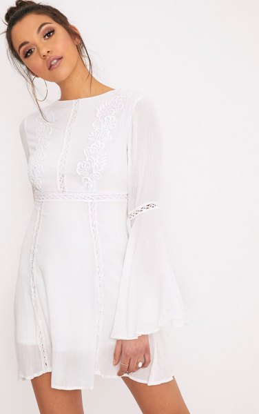 white airy dress with bell sleeves