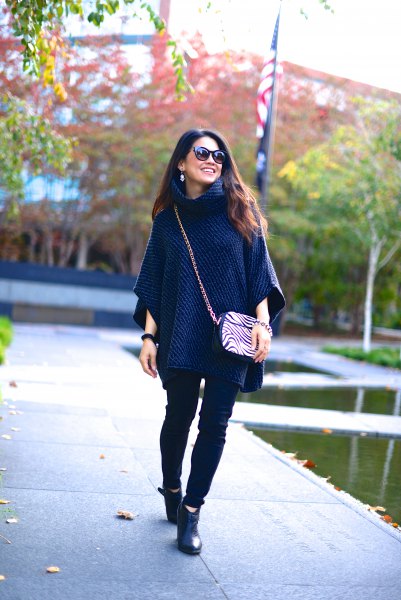 Navy poncho sweater with black skinny jeans