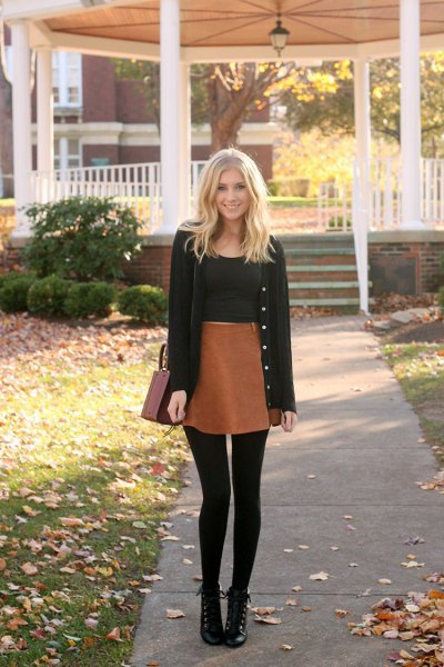 black cardigan with black crop top and brown mini skirt