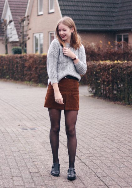 gray cable knit sweater with deep brown mini skirt