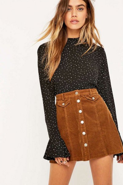 black and white polka dot bell sleeve blouse with brown mini skirt