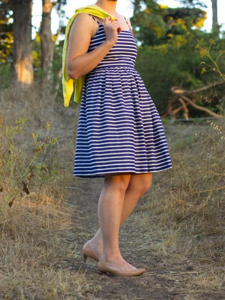 black and white striped fit and flare mini dress with mustard yellow cardigan