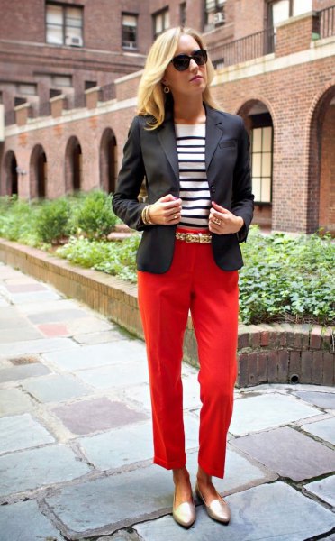 black blazer with red cropped pants and gold slippers