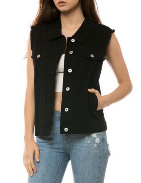unwashed black denim vest with white crop top and blue ripped jeans