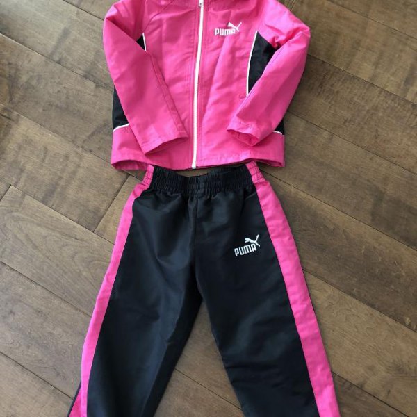 pink windbreaker with black running pants