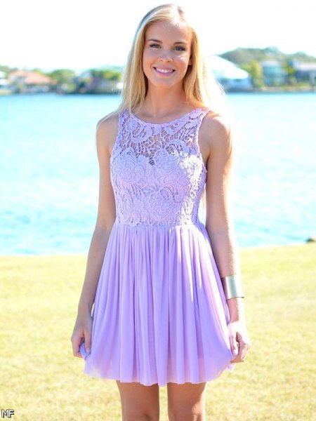 sleeveless lace chiffon dress with a lace fit and flared mini pleats