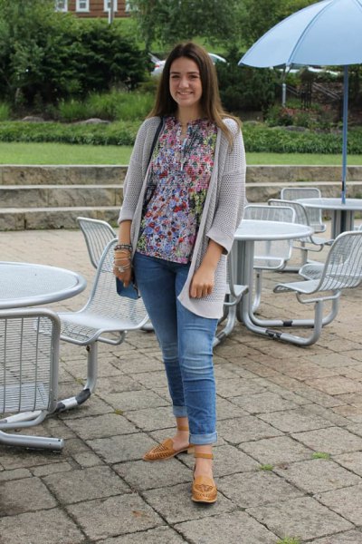 Light gray cardigan with floral blouse and cuffed jeans