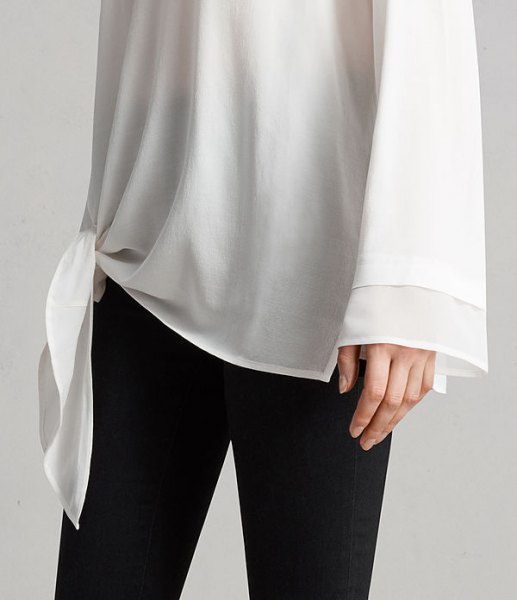 white knotted long sleeve chiffon tunic t-shirt with wide sleeves and black skinny jeans