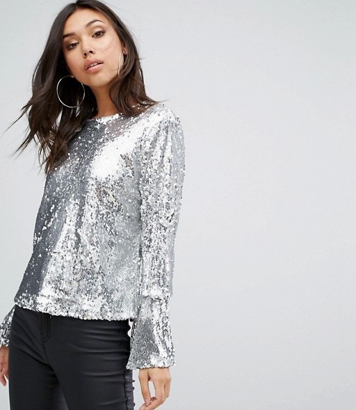silver sequin blouse with bell sleeves and black leather pants