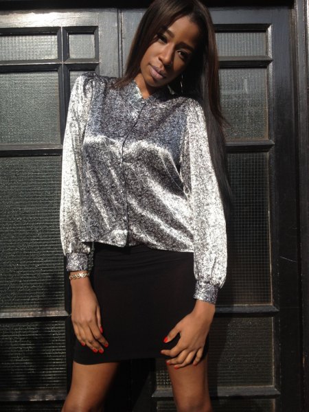 silver metallic blouse with buttons and black mini skirt