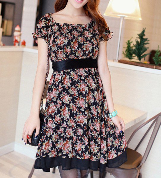 Knee length dress with pink and black belt and floral pattern