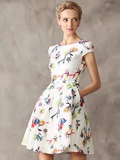 white dress with short sleeves and a flared mini floral pattern