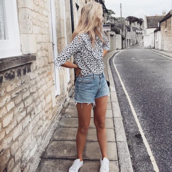 Black and white leopard print blouse and light blue mini shorts