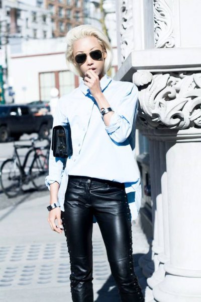 light blue shirt with buttons and black leather pants with laces