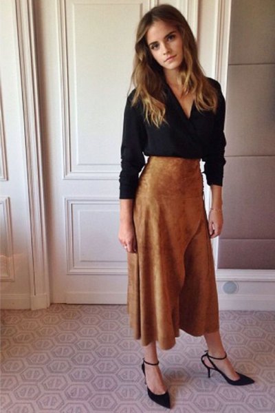 black long sleeve V-neck blouse and brown suede flared maxi skirt